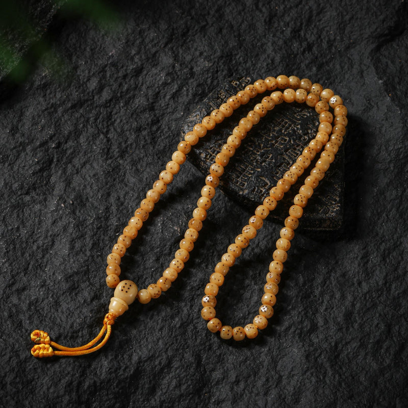 Collier en os de yak composé de 108 perles carrées Mala