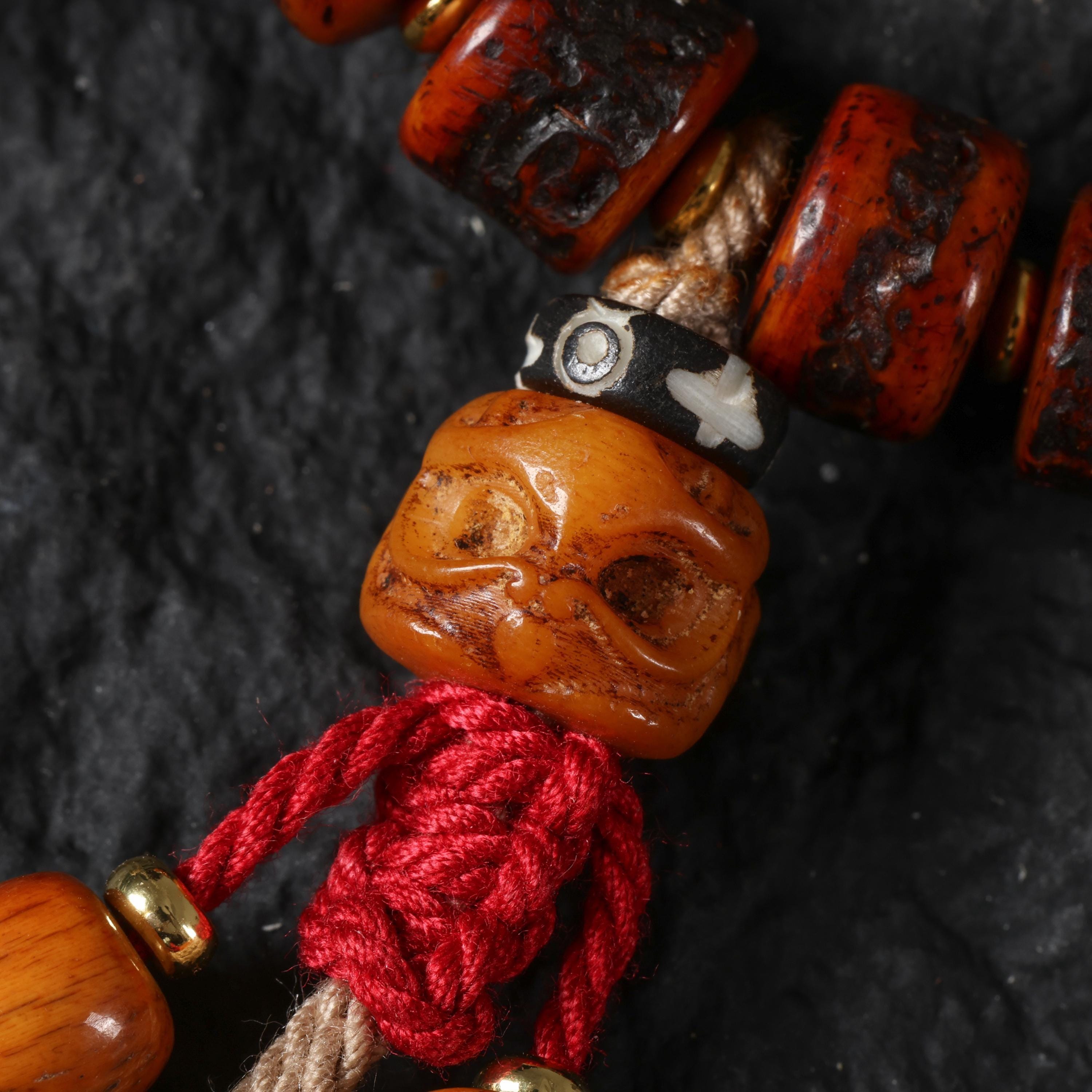 Red Yak Bone Bracelet with Skull & Dzi Beads