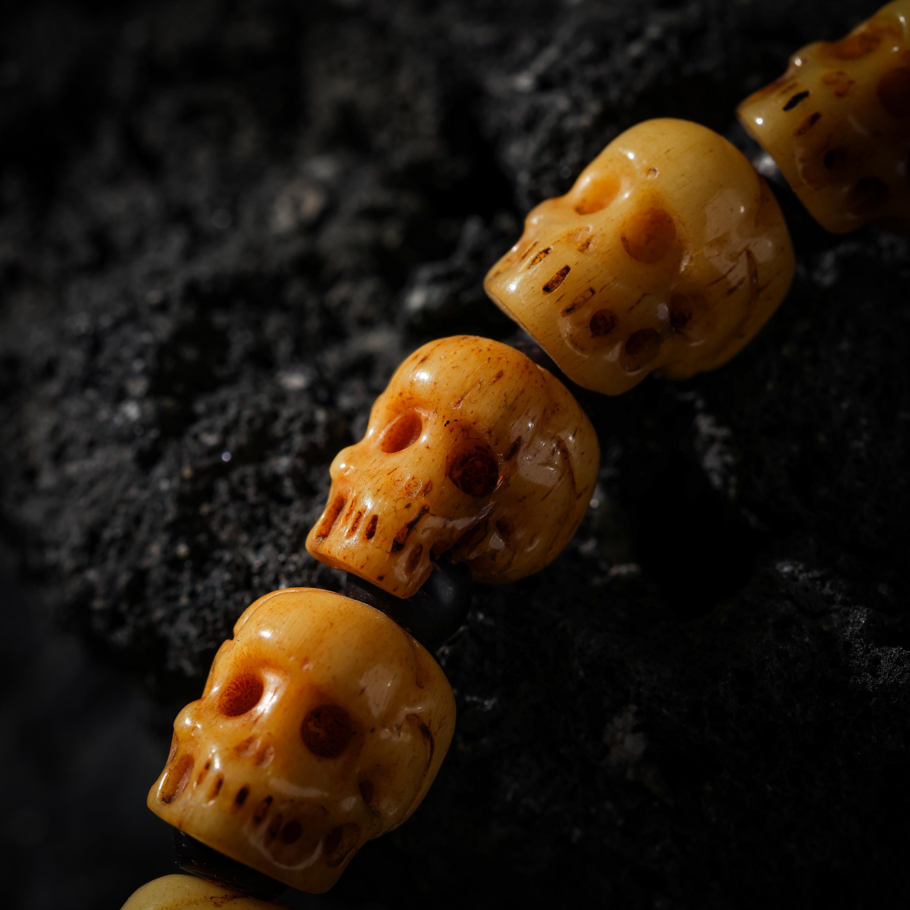 AURA DEER Hand-Carved Yak Bone Skull and Black Agate Bracelet