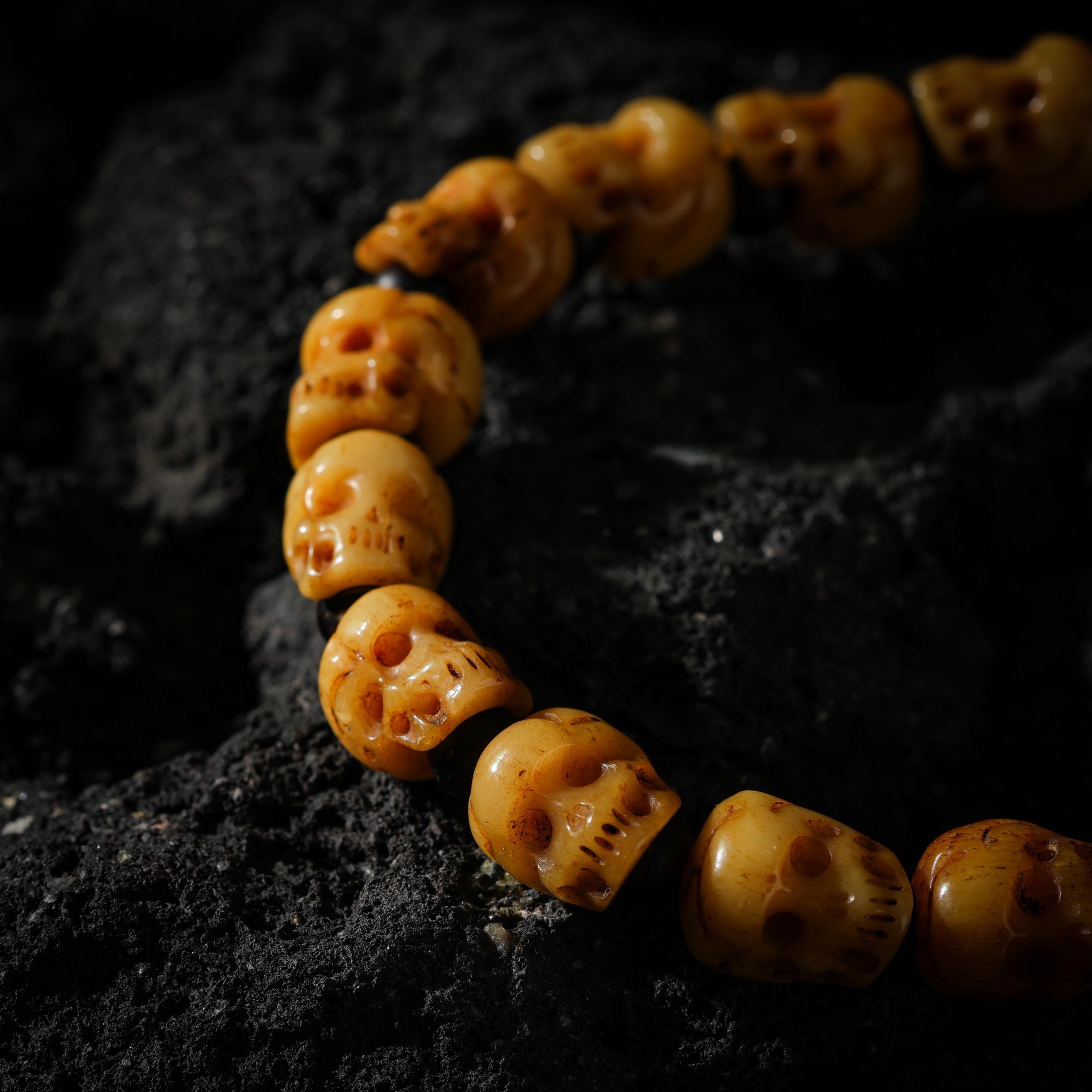 AURA DEER Hand-Carved Yak Bone Skull and Black Agate Bracelet